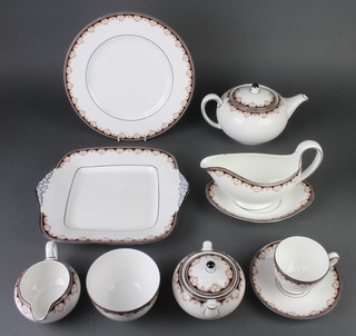 A Wedgwood Medici pattern dinner and tea service comprising 8 tea cups, 8 saucers, teapot, sugar bowl, cream jug, 12 small plates, 8 medium plates, 8 dinner plates, 8 dessert bowls, 8 soup bowls, 3 vegetable dishes, meat plate, sandwich plate, a sauce boat chipped and stand 