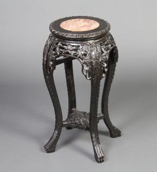 A circular Chinese pierced and carved hardwood jardiniere stand with pink veined marble top, raised on cabriole supports 63cm x 28cm diam. 