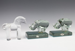 A pair of Swaziland Nowenta coloured glass bookends in the form of rhinoceros 10cm together with a Studio Glass horse 14cm 