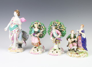 A 19th Century style figure of a standing lady with peacock 26cm and 3 other figure groups 