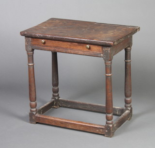 A 17th/18th Century oak side table fitted a frieze drawer, raised on turned and block supports with box framed stretcher 58cm h x 61cm w x 39cm d 