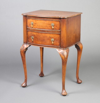 A Queen Anne style figured and crossbanded walnut bow front bedside table fitted 2 frieze drawers, raised on cabriole supports 77cm h x 50cm w x 42cm d 