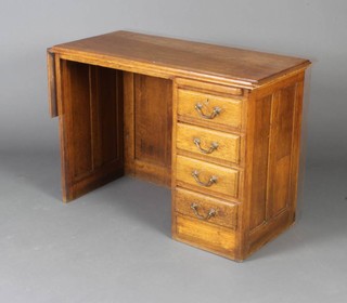 A 1920's light oak desk with drop flap to 1 side, the pedestal fitted a brushing slide above 4 drawers with brass swan neck drop handles 67cm h x 91cm w x 44m d 
