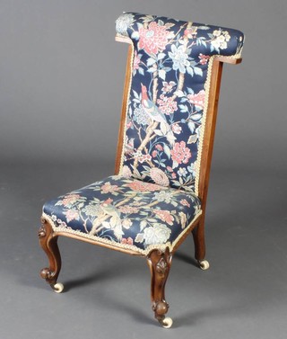 A Victorian bleached mahogany prie-dieu chair with upholstered seat and back 
