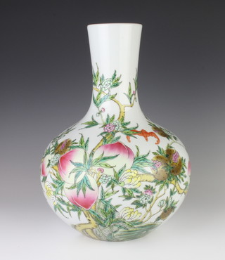 A modern Chinese baluster vase decorated with peaches and bats 38cm 
