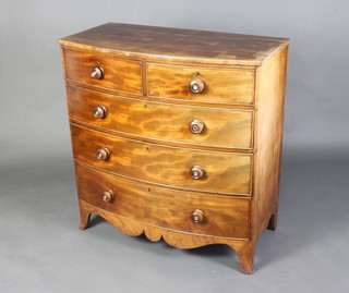 A 19th Century bleached mahogany bow front chest of 2 short and 3 long drawers with tore handles, raised on bracket feet 103cm h x 99cm w x 53cm d 