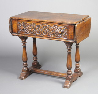 A 17th Century style carved oak drop flap serving table fitted a drawer and raised on 4 turned supports with H framed stretcher 76cm h x 80cm w x 43cm d 