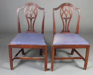 A pair of 19th Century Hepplewhite style mahogany slat back dining chairs with vase shaped slat backs and upholstered drop in seats, raised on square tapered supports with H framed stretcher 