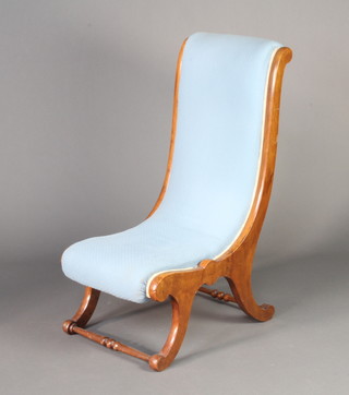 A Victorian mahogany show frame nursing chair upholstered in blue material 