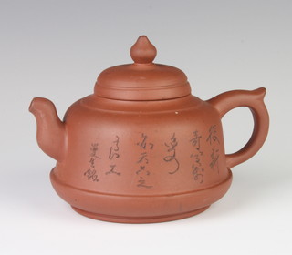 A Chinese Tanware teapot decorated with a landscape view and script 14cm 