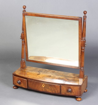 A 19th Century rectangular plate dressing table mirror contained in a mahogany swing frame, the bow front base fitted 3 drawers, raised on bun supports 66cm h x 59cm w x 23cm d 
