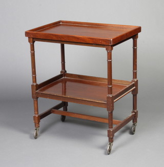 A 1920's rectangular mahogany 2 tier tea trolley raised on turned supports with detachable tray 74cm h x 63cm w x 43cm d 