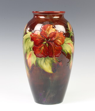 A modern Moorcroft oviform vase, the red ground decorated Hibiscus 30cm 