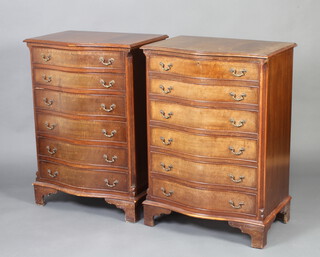 A pair of Georgian style mahogany crossbanded chests of serpentine outline, fitted 6 drawers with canted corners and swan neck drop handles, raised on bracket feet 100cm x 70cm x 49cm 