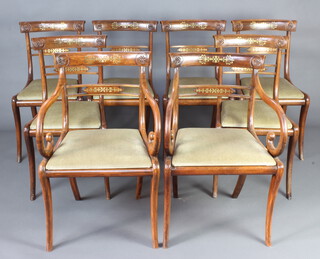 A set of 8 Regency simulated rosewood and inlaid brass bar back dining chairs with plain mid rails and upholstered drop in seats, raised on sabre supports 