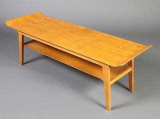 A mid 20th Century rectangular oak and plywood 2 tier coffee table raised on outswept supports 35cm h x 112cm w x 38cm d 