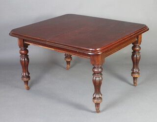 A Victorian mahogany extending dining table raised on turned and reeded supports and with 2 extra leaves 72cm h x 106cm w x 114cm l x 164cm when extended 