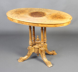 A Victorian inlaid figured walnut centre table raised on 4 turned columns with outswept supports 69cm h x 91cm w x 55cm d 