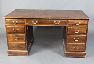 A mahogany kneehole desk with inset writing surface above 1 long and 8 short drawers with brass swan neck drop handles 175cm h x 153cm w x 83cm d 