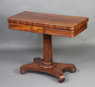 A William IV crossbanded mahogany D shaped card table raised on a turned column and triform base with scroll feet 73cm h x 91cm w x 45cm d 