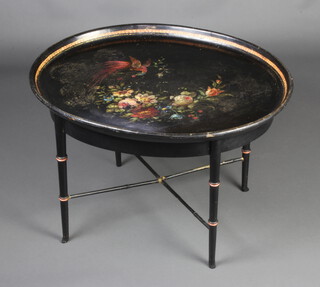 A 19th Century style oval papier mache occasional table raised on faux bamboo supports with X framed stretcher 50cm h x 75cm w x 61cm d 
