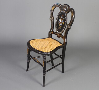A Victorian papier mache and inlaid mother of pearl bedroom chair with woven cane seat raised on turned supports 