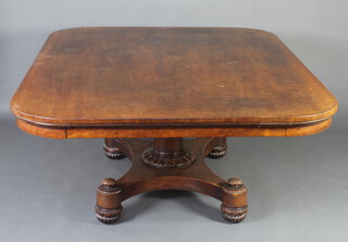 A William IV rectangular shaped mahogany library table raised on a turned column, triform base with bun feet 73cm h x 190cm w x 143cm d 