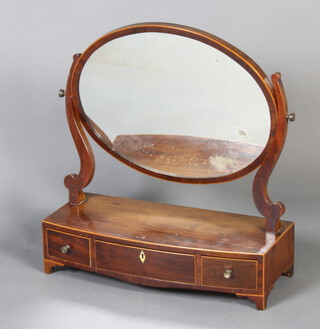 A Georgian mahogany oval plate dressing table mirror raised on a bow front base, fitted 3 drawers, raised on bracket feet 57cm h x 53cm w x 22cm d 