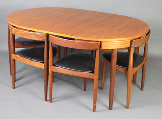 Hans Olsen for Frem Rojle, a mid 20th Century Danish teak "Roundette" dining suite comprising a oval dining table with concealed extra leaf 74cm h x 107cm (156cm extended), together with a set of 6 chairs 