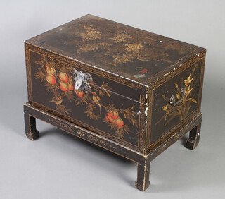A rectangular Oriental black lacquered and floral patterned twin handled coffer on detachable stand 52cm h x 69cm w x 45cm d 