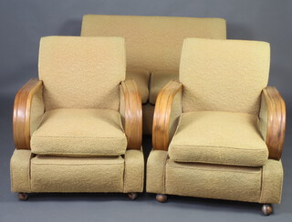 An Art Deco light oak show frame 3 piece suite comprising 2 seat settee 75cm h x 132cm w x 82cm d and 2 armchairs upholstered yellow cut moquette  