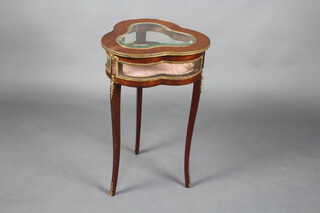 A French mahogany and gilt metal mounted bijouterie table of clover form with hinged lid, raised on 3 cabriole supports, 77cm h x 45cm w x 46cm d 