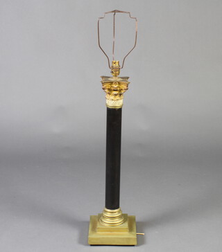A polished stone and gilt metal table lamp with Corinthian capital column, raised on square stepped base 61cm x 18cm x 18cm  