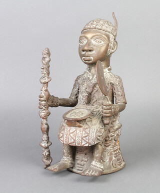 A Benin bronze of a seated figure 26cm x 14cm x 15cm 