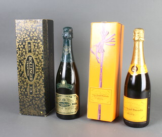 A bottle of Bollinger Tradition RD 1973 champagne disgorged on the 16th June 1982 boxed, (shipped  to celebrate the marriage of HRH Prince Charles and Lady Diana's wedding in 1981) together with a bottle of Veuve Clicquot champagne boxed 
