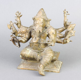 A bronze figure of the Indian god Ganesh raised on square base 15cm x 22cm x 7cm  