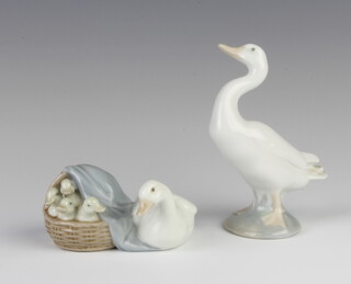 A Lladro figure of a goose and a basket of goslings 6cm together with a figure of a goose 12cm 