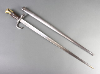 A Victorian French chassepot bayonet with 53cm blade marked D'Armesde Chat 1887, complete with scabbard 
