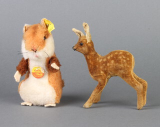 A Steiff figure of Goldie Hamster with ear stud marked 2155/12 13cm and a Steiff figure of a deer 12cm (stud to ear missing) 