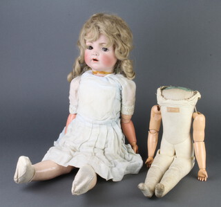 A 19th Century German porcelain headed doll with open and shutting eyes, open mouth, the head incised 50 (f and r) together with a 19th Century German leather jointed dolls body marked Unzerbrechlich Hand Ges. Geschutzt   41cm 