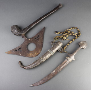 A Jambiya, the 24cm curved blade with "silver" strip, contained in a gilt metal case, together with a pierced iron and hardwood axe 48cm  