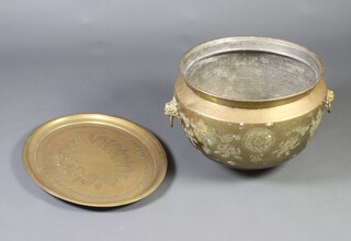 A circular Eastern engraved brass twin handled jardiniere 36cm x 46cm together with an oval brass tray 60cm x 46cm  