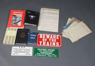 A grey plastic crate containing various British Railways staff notices and train driving manuals etc 
