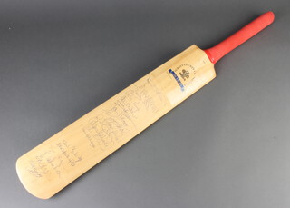 A signed Hunts County cricket bat for the 150th Anniversary of Surrey County Cricket Club, signed by players