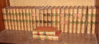 Sir Walter Scott, Waverley Novels, volumes 1, 2 and II, volumes 3-10 and volumes 12-25, published by Adams and Charles, leather bound, together with a first series volume 5, half leather bound by Jedediah Cleishbotham