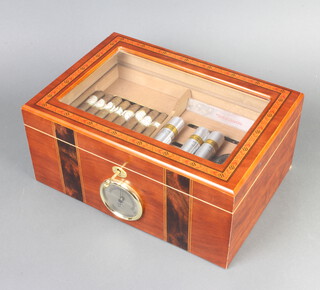An inlaid cedar humidor with hinged lid containing a collection of various cigars, 15cm x 35cm x 24cm 