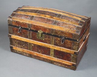 A Victorian leather and fibre bound domed trunk 61cm h x 91cm w x 51cm d, the interior is missing 