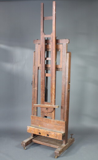 A 19th Century oak adjustable artists easel with ratchett, approx. height 244cm x 72cm w x 65c d