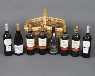 Four bottles of 2007 Marques de Carano Grand Seleccion Rioja, a bottle of 2007 Castillo San Lorenzo Rioja, a bottle of 2007 Old Vines Grenache Noir and a bottle of Marks and Spencers vintage reserve port, contained in a wicker basket 