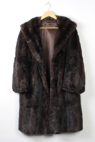 A full length beaver lamb coat, a lady's full length mink coat and 1 other (3) 